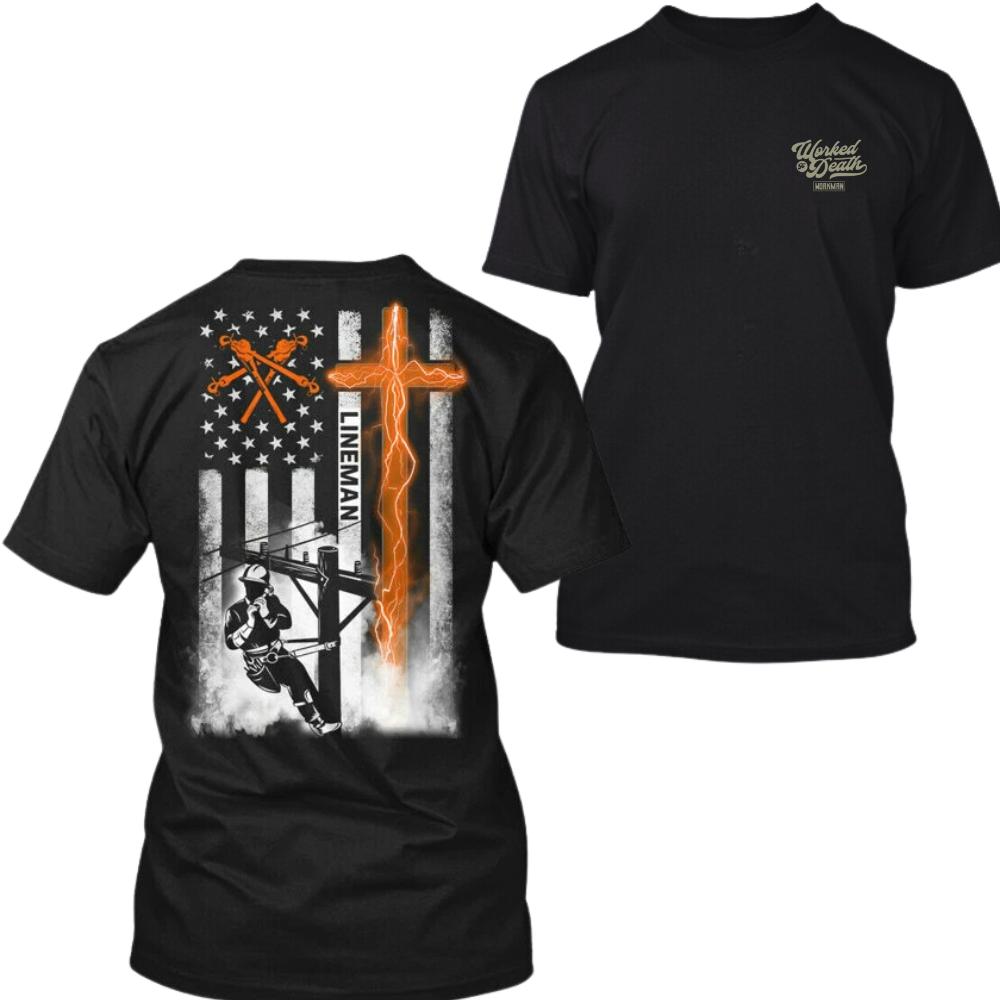 Lineman American Flag Tshirt for Men – Black cotton tee with lineman climbing power pole, glowing orange cross and USA flag, bold Christian workwear gift for electricians. Classic Menswear